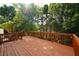 Large wooden back deck overlooking a lush green landscape at 1601 Haven Crest Ct, Powder Springs, GA 30127