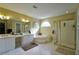 The bathroom has a soaking tub, walk-in shower, and double sink vanity at 1601 Haven Crest Ct, Powder Springs, GA 30127