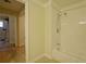 Bathroom area features a tub and shower combo and doorway to another room at 1601 Haven Crest Ct, Powder Springs, GA 30127