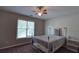Comfortable bedroom featuring a window and neutral decor at 1601 Haven Crest Ct, Powder Springs, GA 30127