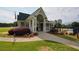 Community clubhouse with manicured landscaping, pool access, and traditional American architecture at 1601 Haven Crest Ct, Powder Springs, GA 30127