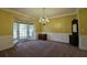 Formal dining room featuring elegant chandelier, large windows, and decorative wainscoting at 1601 Haven Crest Ct, Powder Springs, GA 30127