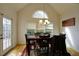 Bright dining room with wood table, chairs, chandelier and natural light at 1601 Haven Crest Ct, Powder Springs, GA 30127
