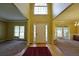 Bright foyer featuring wood and carpet flooring, with great natural light and a high ceiling at 1601 Haven Crest Ct, Powder Springs, GA 30127