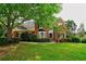 Beautiful red brick home with lush landscaping, a well-maintained lawn, and curb appeal at 1601 Haven Crest Ct, Powder Springs, GA 30127