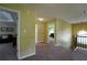 Hallway features neutral carpet and access to living spaces at 1601 Haven Crest Ct, Powder Springs, GA 30127