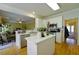 Open kitchen with stainless appliances, island and view to living room at 1601 Haven Crest Ct, Powder Springs, GA 30127
