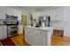 Kitchen with stainless steel appliances, white cabinets and island at 1601 Haven Crest Ct, Powder Springs, GA 30127