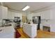 Bright kitchen with white cabinets, stainless appliances, and center island for ample counter space at 1601 Haven Crest Ct, Powder Springs, GA 30127