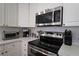Corner of kitchen featuring stainless steel oven and microwave, and small appliances at 1601 Haven Crest Ct, Powder Springs, GA 30127