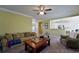 Bright living room featuring carpet, neutral paint, view to kitchen and comfy furniture at 1601 Haven Crest Ct, Powder Springs, GA 30127