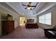 Spacious main bedroom has a trey ceiling, fan, and plenty of space for furniture at 1601 Haven Crest Ct, Powder Springs, GA 30127