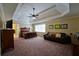 Spacious main bedroom has a trey ceiling, fan, and plenty of space for furniture at 1601 Haven Crest Ct, Powder Springs, GA 30127