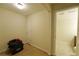 Room with neutral walls and trim, alongside an open doorway to another room at 1601 Haven Crest Ct, Powder Springs, GA 30127