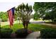 View of the street with a US flag, showcasing the neighborhood and community at 1601 Haven Crest Ct, Powder Springs, GA 30127