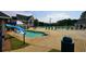 Full community swimming pool with lounge chairs, tables, and a shallow water kid-friendly play area at 1601 Haven Crest Ct, Powder Springs, GA 30127