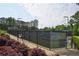 Community tennis courts bordered by trees and landscaping at 1601 Haven Crest Ct, Powder Springs, GA 30127
