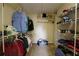 Well-organized walk-in closet with shelves and hanging storage at 1601 Haven Crest Ct, Powder Springs, GA 30127