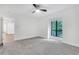 Spacious bedroom with a ceiling fan, carpeted floor, window with natural light, and white walls at 206 Tuxworth Cir, Decatur, GA 30033