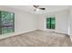 Large bedroom with carpet, two windows, a ceiling fan, and natural light at 206 Tuxworth Cir, Decatur, GA 30033
