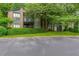 Condo with brick and siding, balcony, manicured lawn, and parking lot at 206 Tuxworth Cir, Decatur, GA 30033