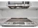 Close up of stainless steel flat-top range with granite countertop at 206 Tuxworth Cir, Decatur, GA 30033