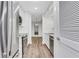 Modern kitchen with white cabinets, stainless appliances, and sleek wood floors at 206 Tuxworth Cir, Decatur, GA 30033