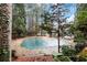 Community pool with cover during off-season amid trees and lush landscaping at 206 Tuxworth Cir, Decatur, GA 30033