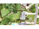 Aerial view of a home featuring a well-manicured lawn, mature trees, and a swimming pool at 224 Mountain View Dr, Woodstock, GA 30188
