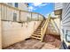 Staircase leading to backyard with wood fence and brick patio at 224 Mountain View Dr, Woodstock, GA 30188