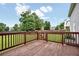 Wood deck overlooking a green, fenced backyard with mature trees at 224 Mountain View Dr, Woodstock, GA 30188