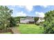 Expansive backyard featuring large lawn, fence, and screen porch at 224 Mountain View Dr, Woodstock, GA 30188