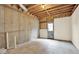 Unfinished basement space ready for customization with walkout door at 224 Mountain View Dr, Woodstock, GA 30188