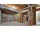 Unfinished basement with exposed framing and concrete floor at 224 Mountain View Dr, Woodstock, GA 30188