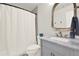 Cozy bathroom featuring a shower, toilet and marble sink at 224 Mountain View Dr, Woodstock, GA 30188