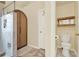 Clean bathroom featuring a toilet, shelves, shower, and vanity at 224 Mountain View Dr, Woodstock, GA 30188