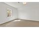 Bright, carpeted bedroom with a window letting in natural light at 224 Mountain View Dr, Woodstock, GA 30188