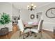 Bright dining area with a round table, stylish chandelier, and easy access to other living spaces at 224 Mountain View Dr, Woodstock, GA 30188