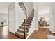 Charming entryway features hardwood floors, stairs, and a view of the dining room at 224 Mountain View Dr, Woodstock, GA 30188
