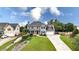 Beautiful two-story home with a long driveway, lush lawn and professional landscaping at 224 Mountain View Dr, Woodstock, GA 30188