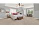 Spacious main bedroom with natural light, a ceiling fan, and neutral paint at 224 Mountain View Dr, Woodstock, GA 30188