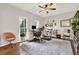 A bright home office features a desk, chair, decor, and a large window for natural light at 224 Mountain View Dr, Woodstock, GA 30188