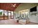 Inviting screened-in porch with comfortable seating and a mounted TV at 224 Mountain View Dr, Woodstock, GA 30188