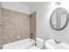 Bathroom featuring a tub, shower, toilet and sink, all with a clean, functional design at 5865 Trailwood Ct, Suwanee, GA 30024