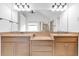 Bathroom with double sinks, granite countertops, and a large mirror at 5865 Trailwood Ct, Suwanee, GA 30024