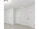 Neutral bedroom with three doors at 5865 Trailwood Ct, Suwanee, GA 30024