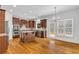 Spacious kitchen features an island, stainless steel appliances, hardwood floors, and ample natural light at 5865 Trailwood Ct, Suwanee, GA 30024