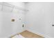 Tiled laundry room with connections, offering functionality and a clean space for laundry tasks at 5865 Trailwood Ct, Suwanee, GA 30024