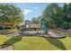 View of a playground with green slides and a wood bridge at 5865 Trailwood Ct, Suwanee, GA 30024
