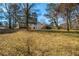 Large backyard with mature trees, perfect for outdoor activities at 1890 Carla Dr, Morrow, GA 30260